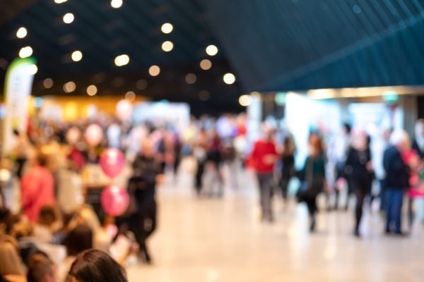 Blurred image of people networking at a large event